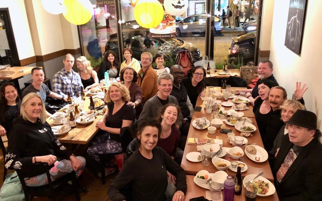Paulie Zink having a vegan dinner with his Yin yoga Teacher Training workshop students