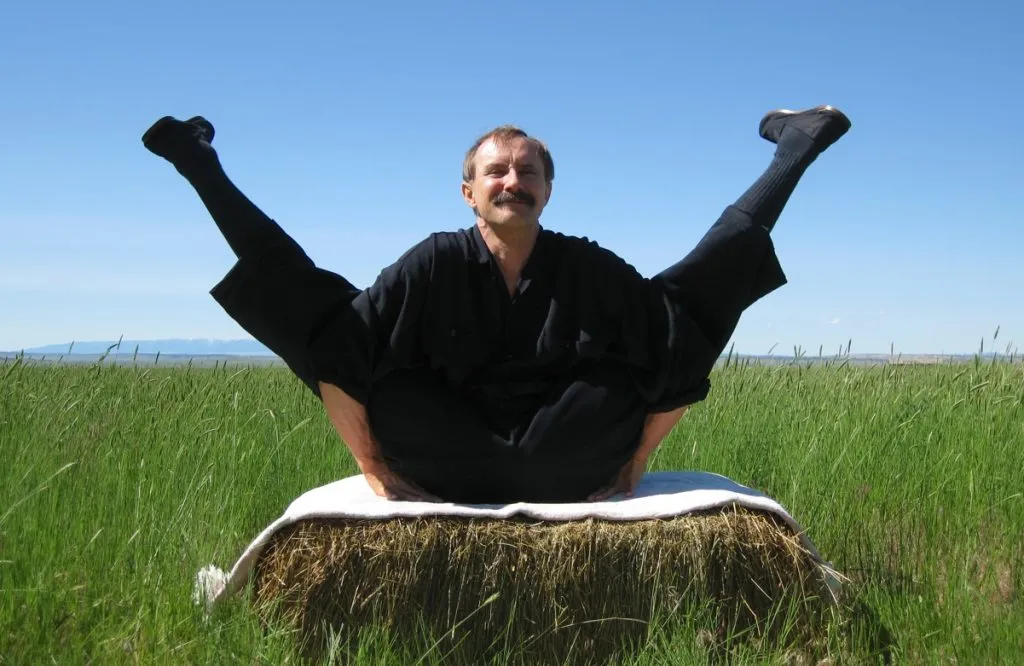 Paulie Zink does advanced sitting Crab Yin yoga pose